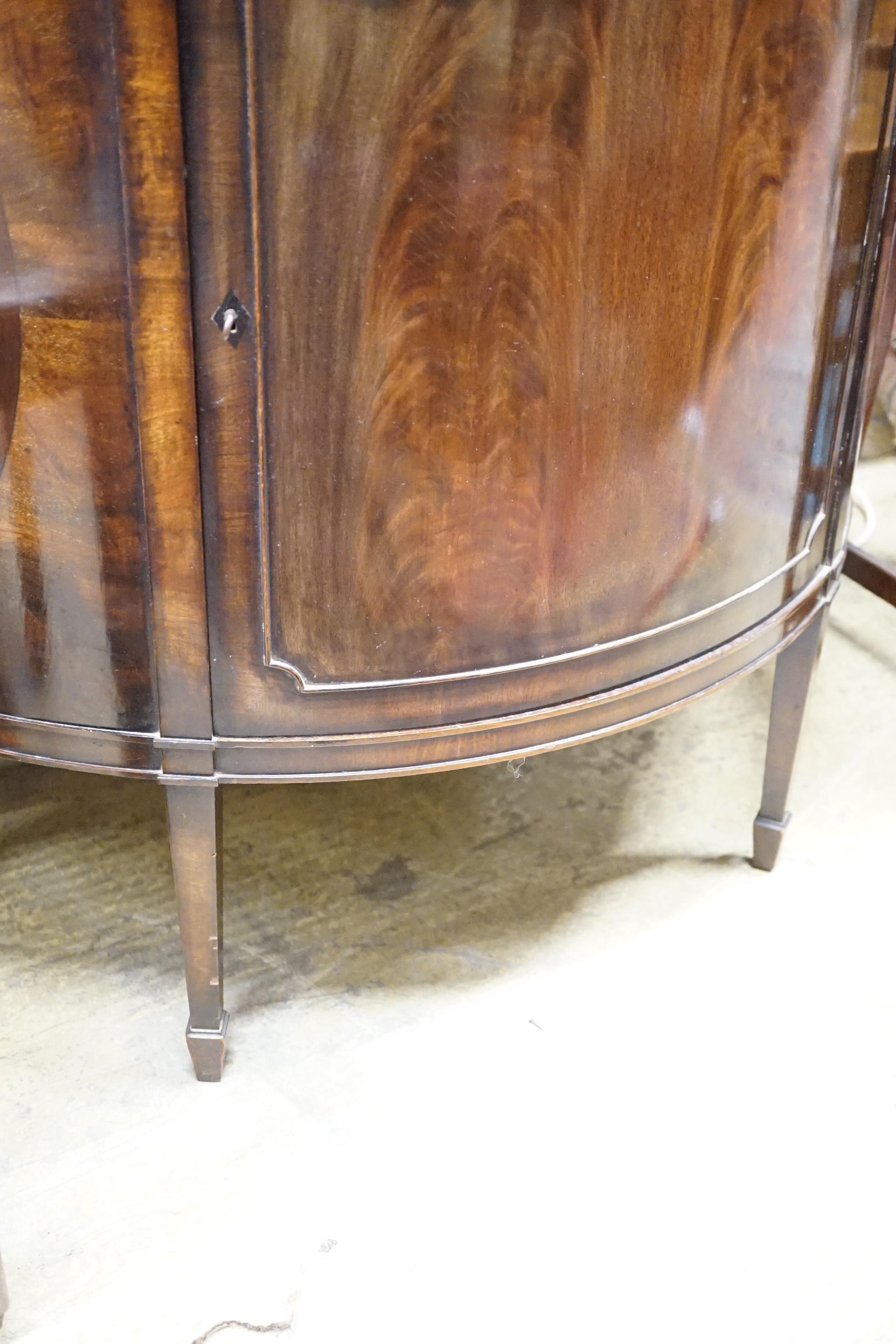 An early 20th century Maple & Co. mahogany demi-lune side cabinet with frieze drawer, width 84cm, height 84cm